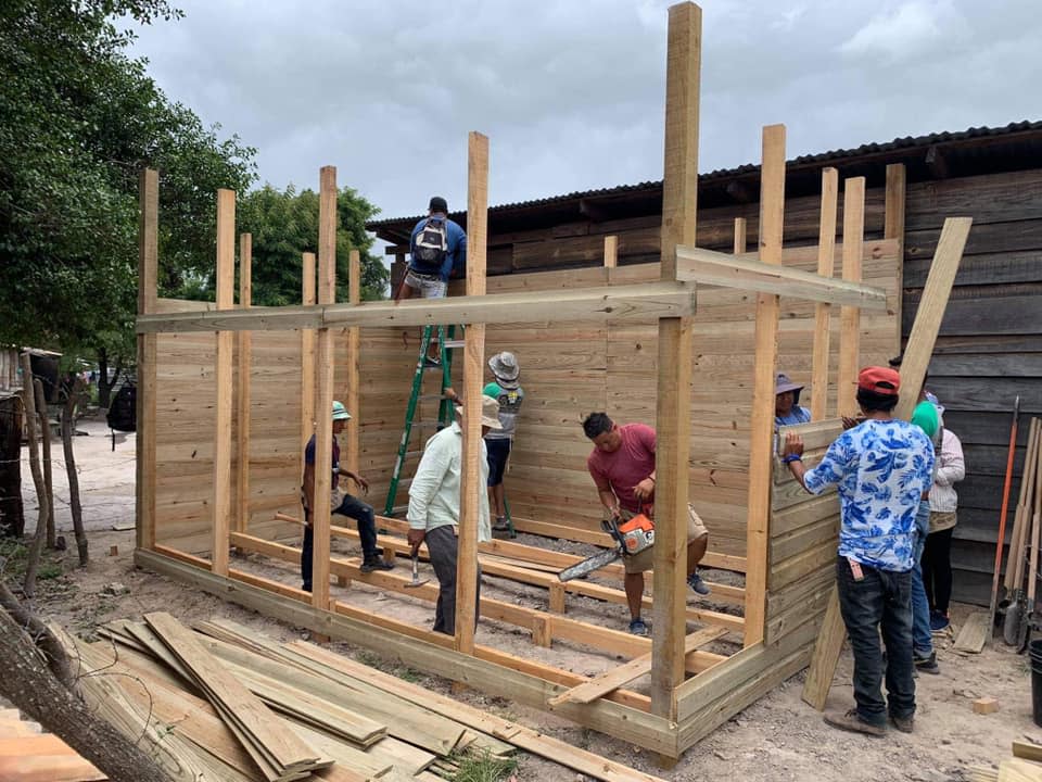 Workers with In the Midst ministries work to construct a John Luke Carver Home of Hope in Honduras. The Carver family is raising money to build the homes in his memory.