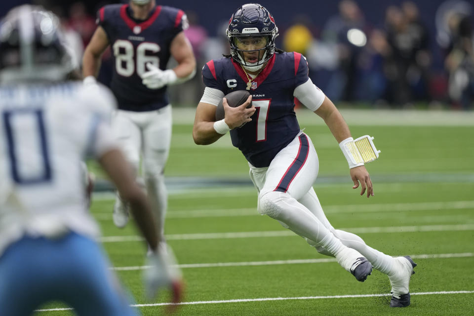 Houston Texans quarterback C.J. Stroud (7) runs the ball against the Tennessee Titans during the first half of an NFL football game Sunday, Dec. 31, 2023, in Houston. (AP Photo/David J. Phillip)