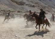 Afghan horsemen compete during a Buzkashi game in Panjshir province, north of Kabul, Afghanistan April 7, 2017. REUTERS/Omar Sobhani