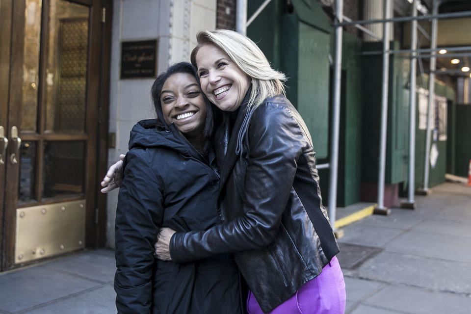 <p>Yahoo Global News Anchor Katie Couric hugs Olympic gold medalist Simone Biles in New York City’s Theater District on Nov. 18. (Gordon Donovan/Yahoo News) </p>