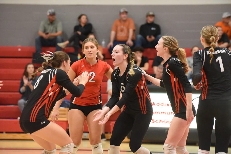 Addison celebrates a point during Tuesday's match against Homer.