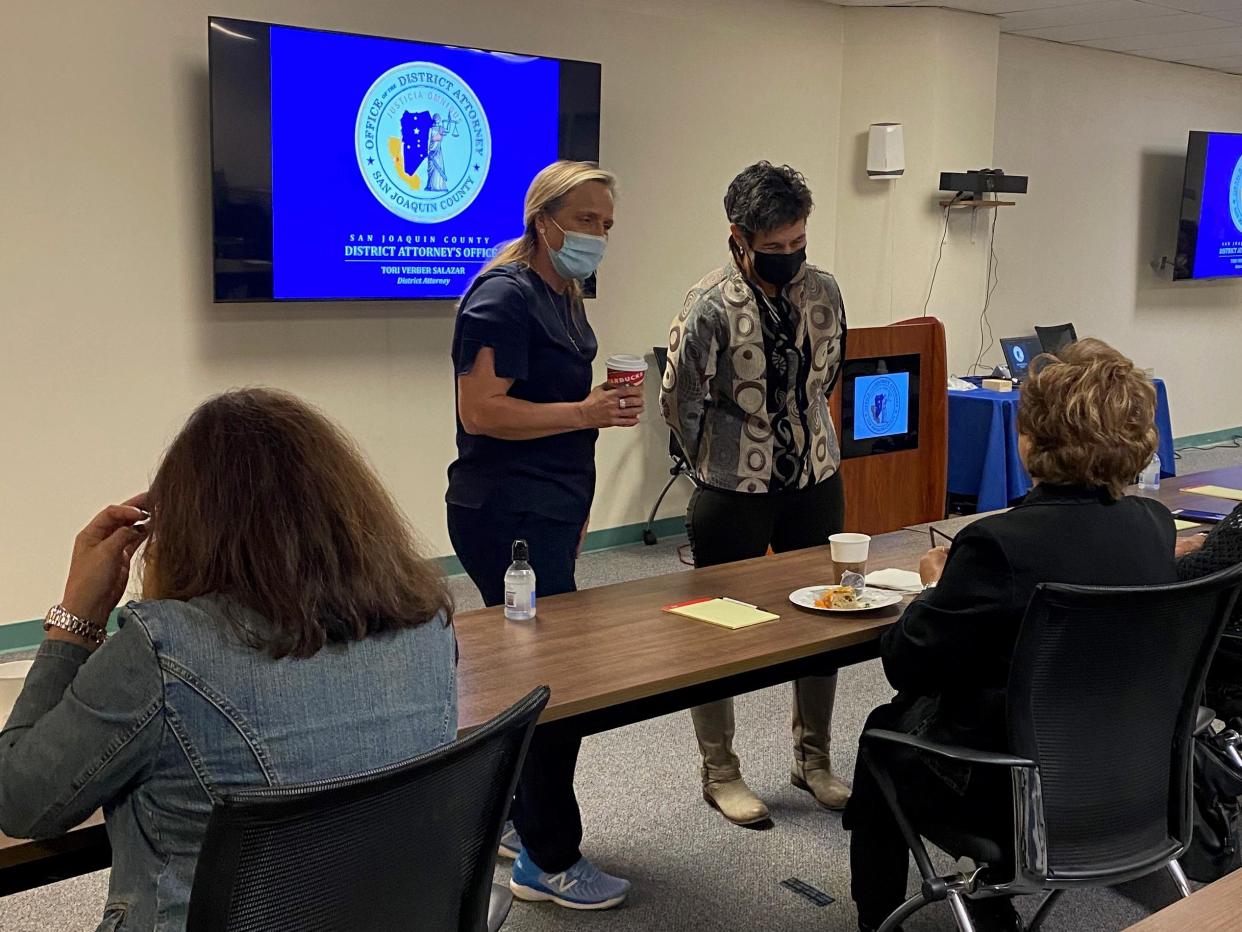 San Joaquin District Attorney Tori Verber Salazar (left) stands next to State Senator Susan Talamantes Eggman (right) during a meeting with victims, survivors and family members of sexual assault and/or violent crimes on Dec. 3, 2021.