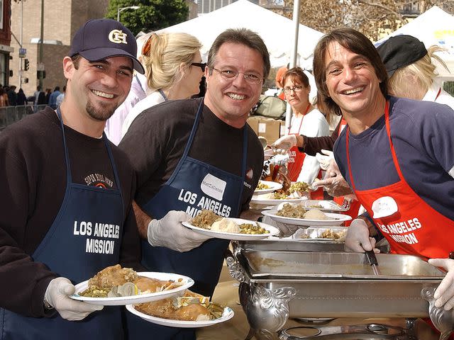 <p>Gregg DeGuire/WireImage</p> Tony Danza, son Marc and brother Matt during the Los Angeles Mission Thanksgiving Meal for the Homeless.