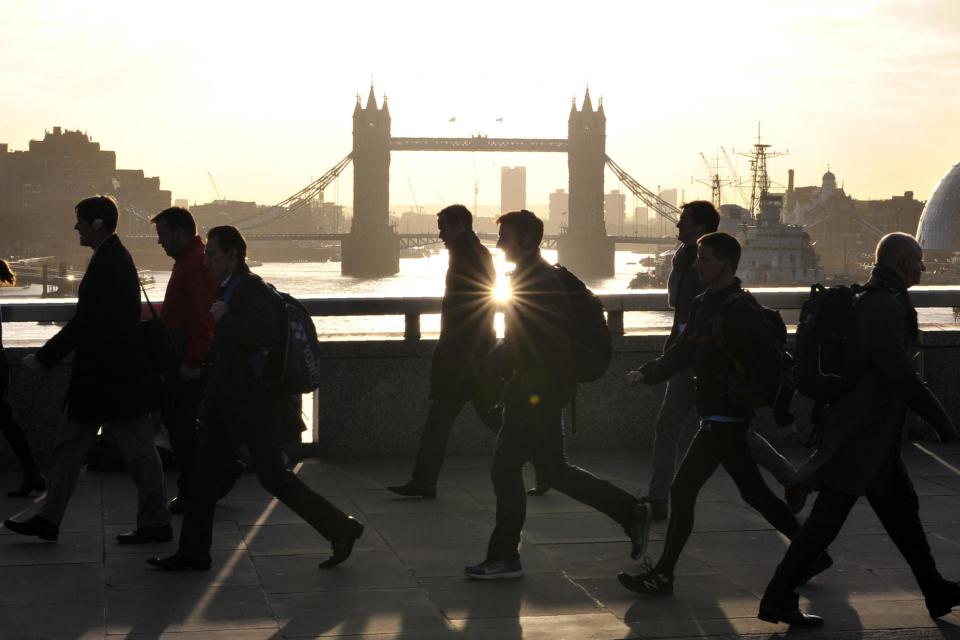 Morning commuters walk across London Bridge: AFP/Getty Images