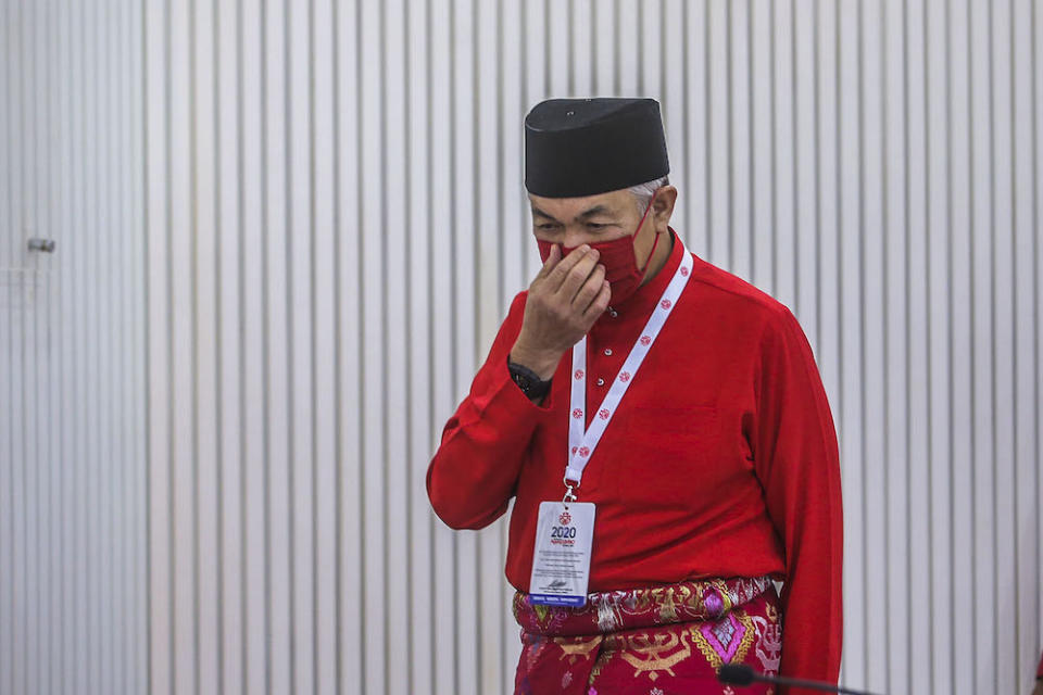 Umno president Datuk Seri Ahmad Zahid Hamidi (centre) speaks to reporters during the press conference at the 2020 Umno annual general meeting in Kuala Lumpur March 28, 2021. ― Picture by Hari Anggara