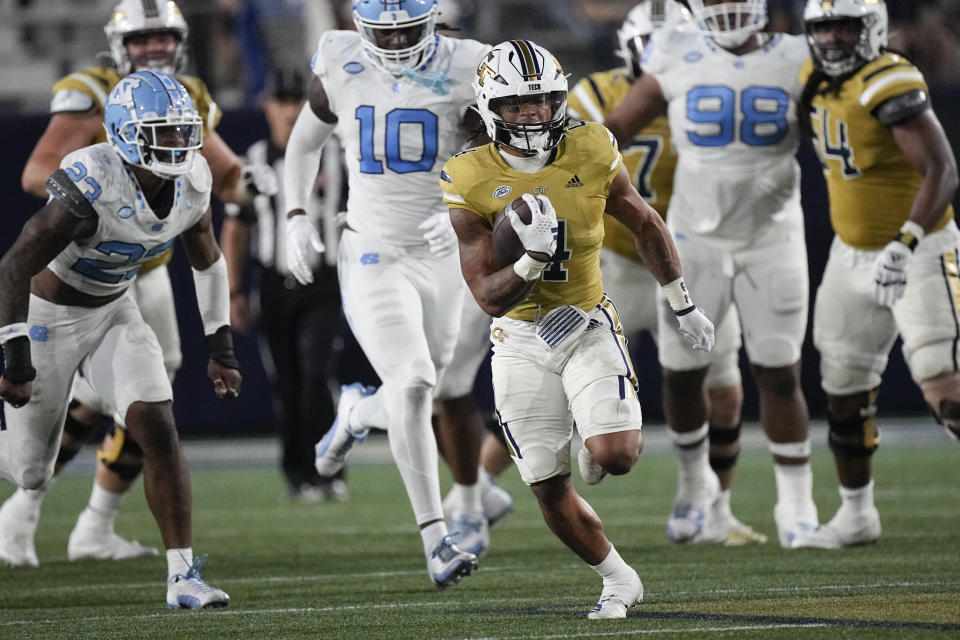 Georgia Tech running back Dontae Smith (4) runs for a touchdown during the second half of an NCAA college football game against North Carolina, Saturday, Oct. 28, 2023, in Atlanta. (AP Photo/John Bzemore)