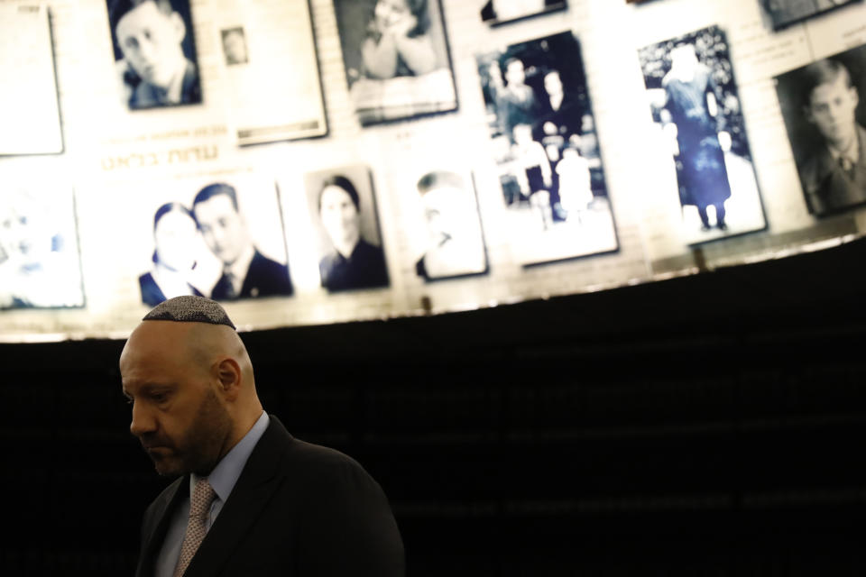 Lebanese-born Swiss real estate mogul Abdallah Chatila who purchased Nazi memorabilia at a German auction and is donating the items to Israel, visits at the Hall of Names in Yad Vashem in Jerusalem, Sunday, Dec. 8, 2019. Chatila, a Lebanese Christian who has lived in Switzerland for decades, paid some 600,000 euros ($660,000) for the items at the Munich auction last month, intending to destroy them after reading of Jewish groups' objections to the sale. Shortly before the auction, however, he decided it would be better to donate them to a Jewish organization. (AP Photo/Ariel Schalit)