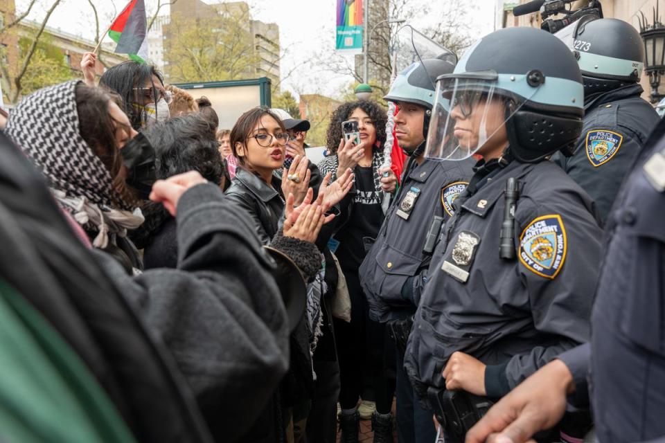 Students and pro-Palestinian activists face police as they gather outside of Columbia University (Getty Images)