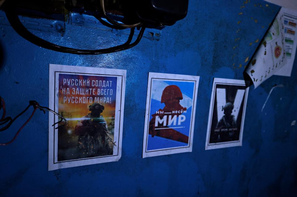 Propaganda posters inside the Balakliia base (Reuters)