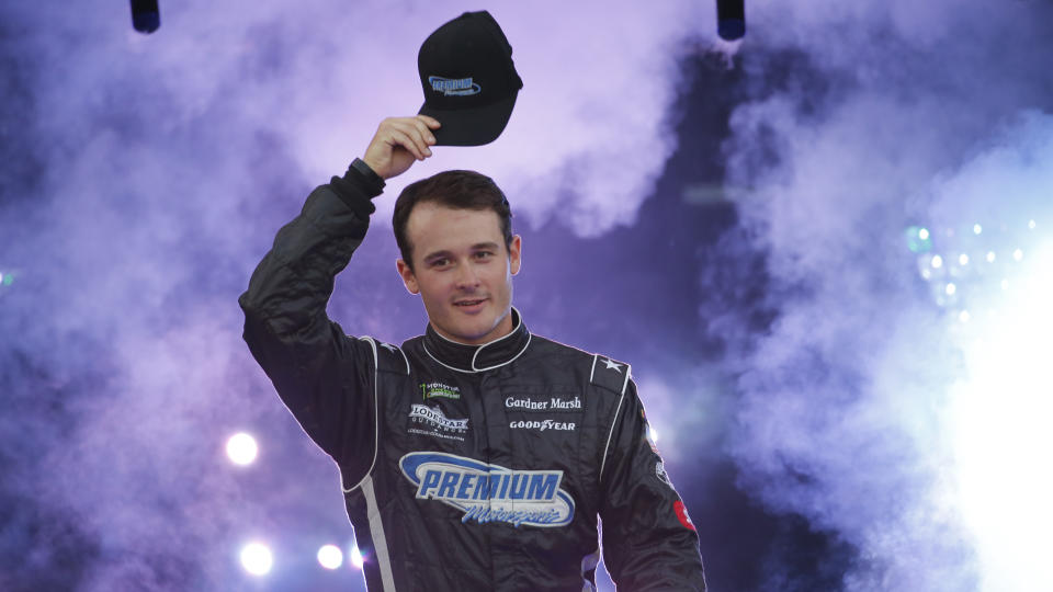 Quin Houff tips his hat during driver introductions for the NASCAR Monster Energy Cup series auto race at Richmond Raceway in Richmond, Va., Saturday, Sept. 21, 2019. (AP Photo/Steve Helber)