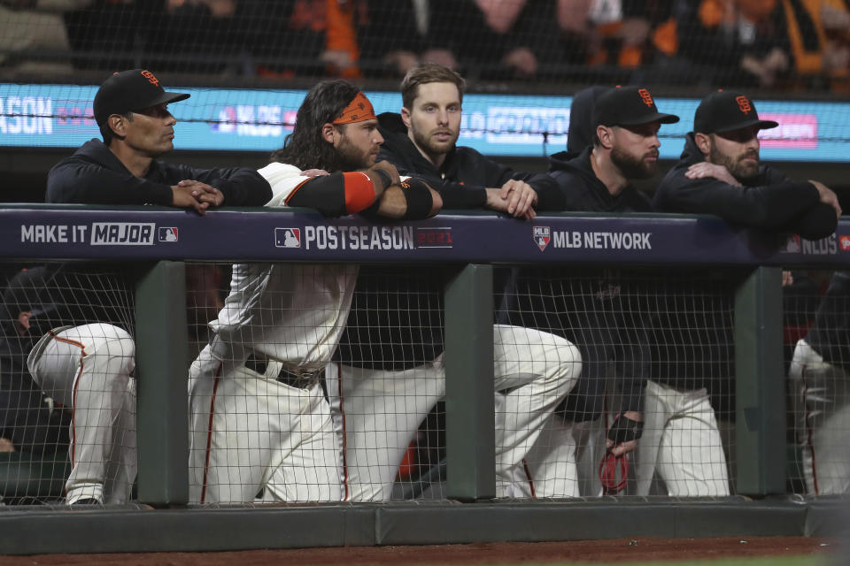 San Francisco Giants players watch during the ninth inning of Game 5 of a baseball National League Division Series against the Los Angeles Dodgers Thursday, Oct. 14, 2021, in San Francisco. (AP Photo/Jed Jacobsohn)