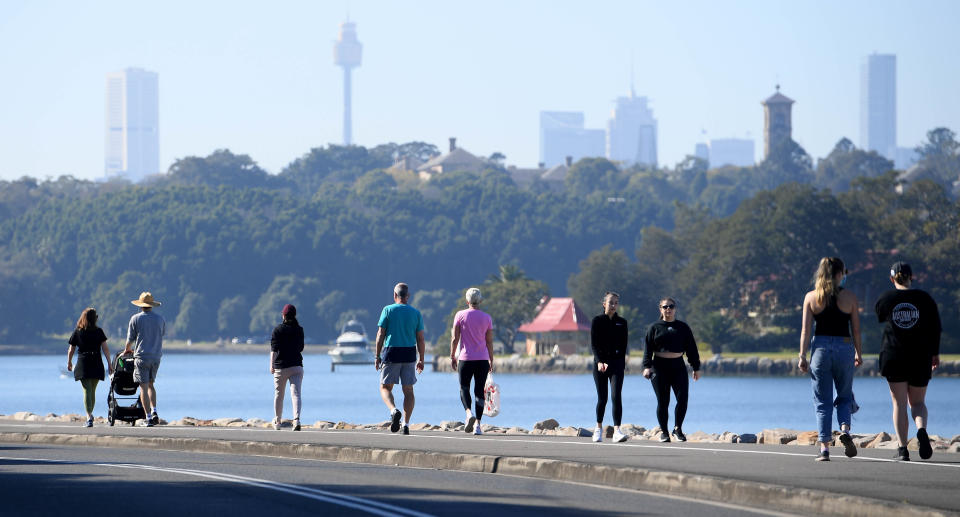 People are seen exercising at the Bay Run in Sydney, Saturday, August 14, 2021. Greater Sydney and surrounding regions are in lockdown until at least August 28 and the NSW Hunter will be locked down for a week as health authorities battle to contain an outbreak of the virulent Delta strain. (AAP Image/Dan Himbrechts) NO ARCHIVING