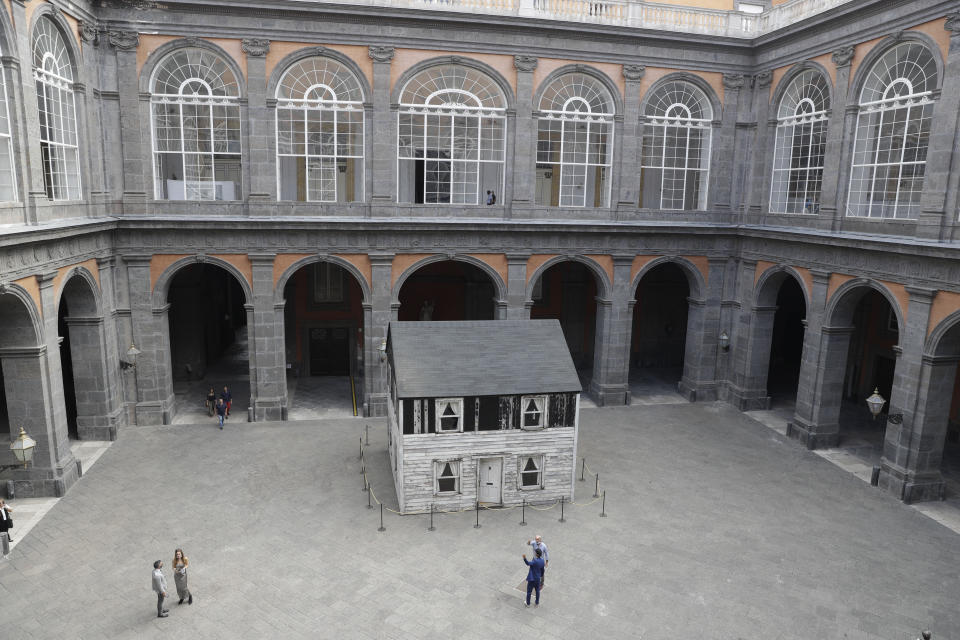 The house of U.S. civil rights campaigner Rosa Parks, rebuilt by artist Ryan Mendoza, is on display in the courtyard of an 18th century Royal Palace, in Naples, Italy, Tuesday, Sept. 15, 2020. It’s the latest stop for the house in a years-long saga that began when Parks’ niece saved the tiny two-story home from demolition in Detroit after the 2008 financial crisis. (AP Photo/Gregorio Borgia)