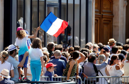 People gather near the Pantheon before a national tribute to late Auschwitz survivor and French health minister Simone Veil and her late husband Antoine Veil in Paris, France, July 1, 2018. REUTERS/Pascal Rossignol