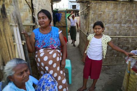 A Muslim family, whose house was destroyed in 2013 during anti-Muslim violence and unrest, is seen at their temporary new home at Thiriminglar quarter in Meiktila, Myanmar May 14, 2015. REUTERS/Soe Zeya Tun