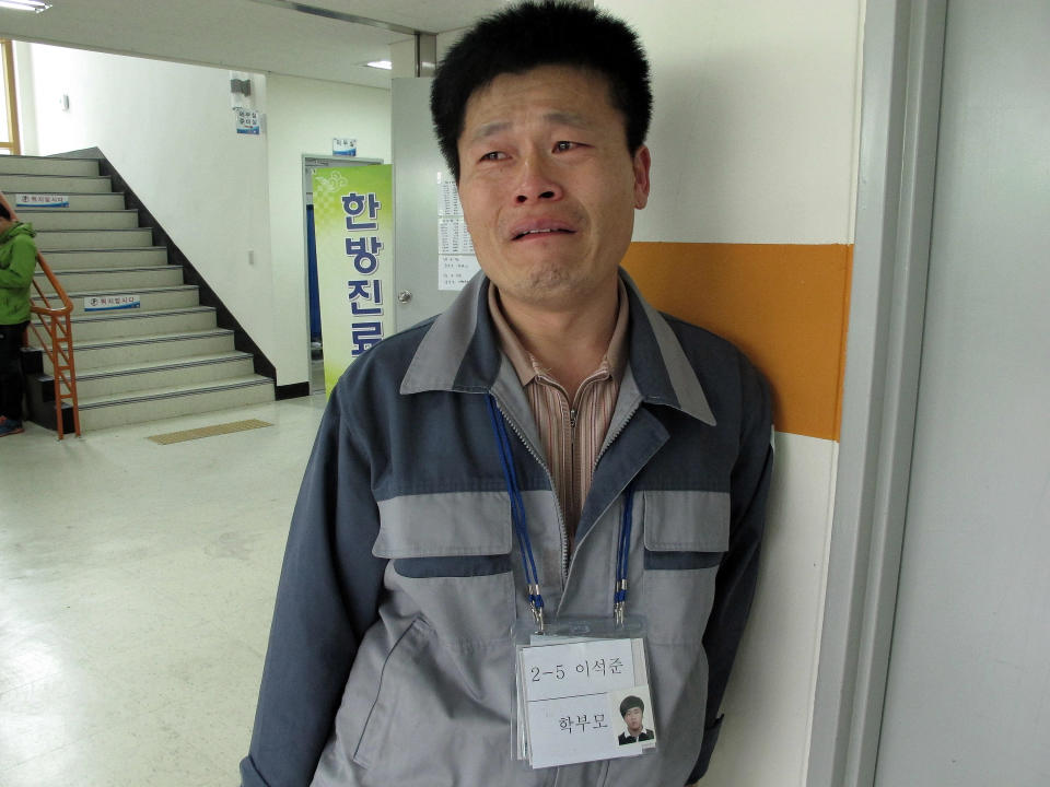 Lee Byung-soo, 47, the father of Lee Seok-joon, 15, one of missing passengers aboard the sunken ferry Sewol, cries during an interview at a gymnasium in Jindo, South Korea Saturday, April 19, 2014. Relatives of about 270 people missing have grown increasingly exasperated and distrusting of South Korean authorities, in part because of confusion, early missteps and perceived foot-dragging. For days, they have dealt with shock, fear and bewilderment. They have briefly been buoyed by new ideas for finding survivors, changes in death counts and the number of missing, even rumors of contact with trapped relatives, only to be let down later. (AP Photo/Gillian Wong)