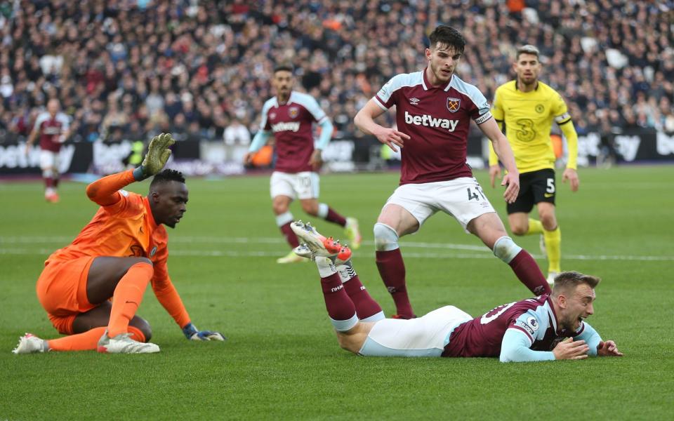 West Ham United's Jarrod Bowen is brought down by Chelsea's Edouard Mendy to earn his side a penalty during the Premier League match between West Ham United and Chelsea at London Stadium - GETTY IMAGES