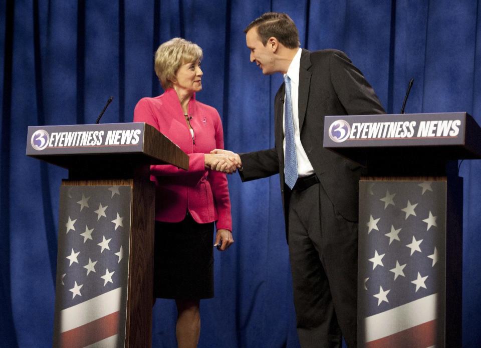 Republican candidate for U.S. Senate Linda McMahon, left, shakes hands with Democratic candidate for U.S. Senate Chris Murphy at the end of a live televised debate in Rocky Hill, Conn., Sunday, Oct. 7, 2012. Democrats are counting on their New England friends to help them pick up Republican-held Senate seats on Nov. 6 and construct a barrier against losses in Nebraska and elsewhere that could erase their majority. Republican hopes of swiping the seat in Connecticut are fading. Murphy has steadied his campaign against McMahon, who spent $50 million on an unsuccessful bid in 2010 and $42.6 million and counting this year. McMahon's less-than-stellar debate performances and the state's Democratic tilt have undercut the GOP candidate's prospects. (AP Photo/Jessica Hill, File)