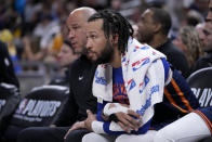 New York Knicks guard Jalen Brunson watches from the bench during the second half of Game 4 against the Indiana Pacers in an NBA basketball second-round playoff series, Sunday, May 12, 2024, in Indianapolis. (AP Photo/Michael Conroy)