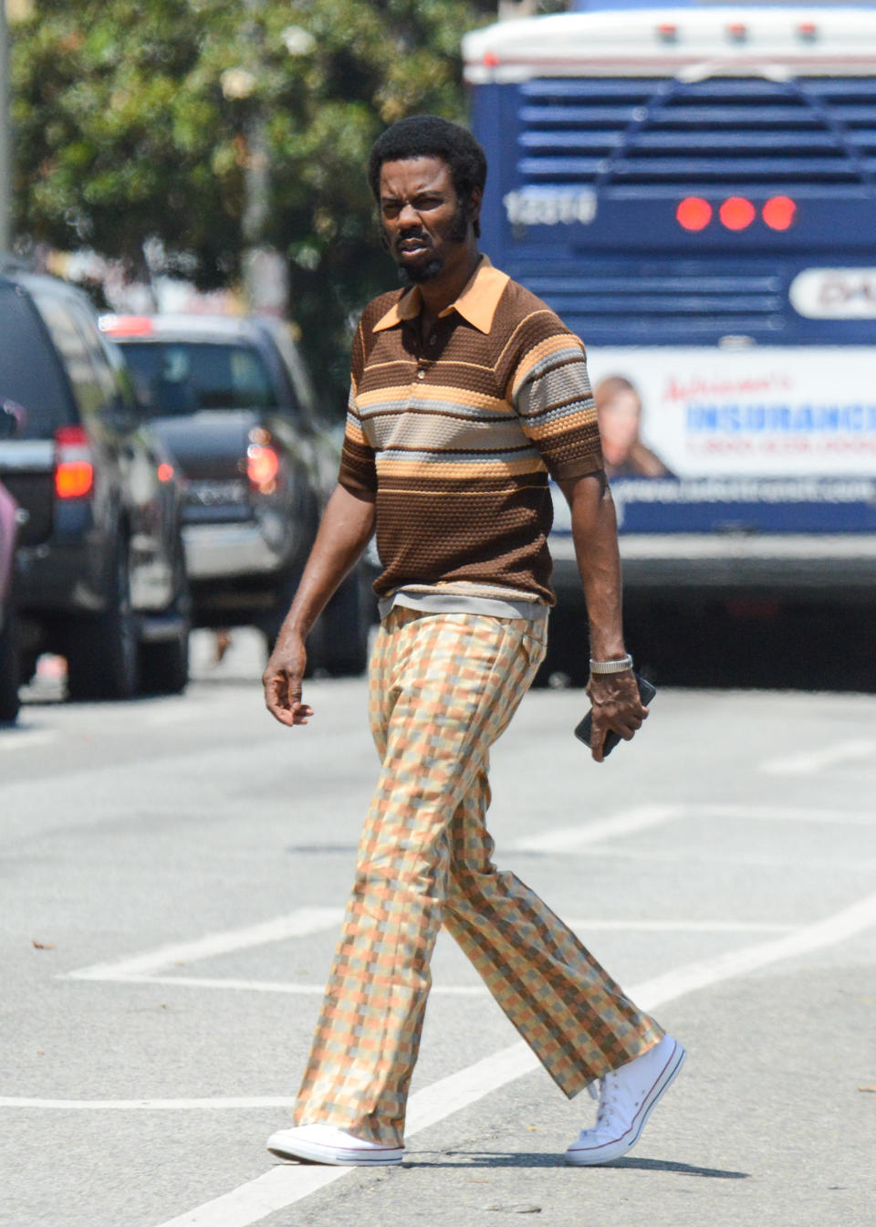 Chris Rock spotted on set in a ’70s ensemble. (Photo: Getty Images)