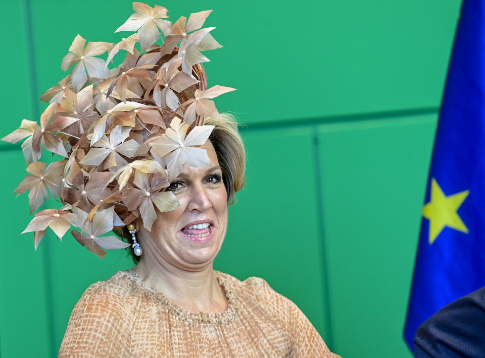 Queen Maxima of the Netherlands laughs during a meeting with Wolfgang Schaeuble, the President of the Bundestag, the lower house of parliament, at the parliament in Berlin, Germany, July 6, 2021. The Dutch royal couple is on a state visit to Germany until July 7, 2021. (Tobias Schwarz/AP via Pool)