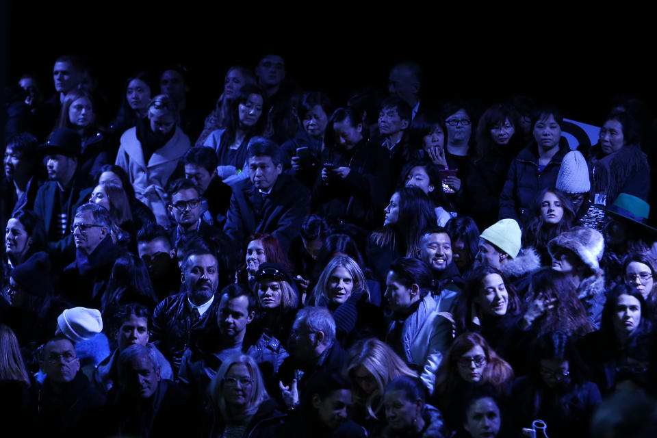 Audience members await the start of the Alexander Wang Fall 2014 collection show during Fashion Week in New York, Saturday, Feb. 8, 2014. (AP Photo/Jason DeCrow)