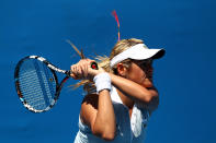 MELBOURNE, AUSTRALIA - JANUARY 17: Aleksandra Wozniak of Canada plays a backhand in her first round match against Shuai Zhang of China during day two of the 2012 Australian Open at Melbourne Park on January 17, 2012 in Melbourne, Australia. (Photo by Ryan Pierse/Getty Images)