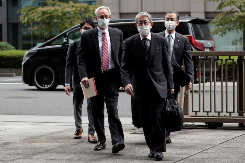 Greg Kelly, former representative director of Nissan Motor Co., arrives for the first trial hearing at the Tokyo District Court in Tokyo