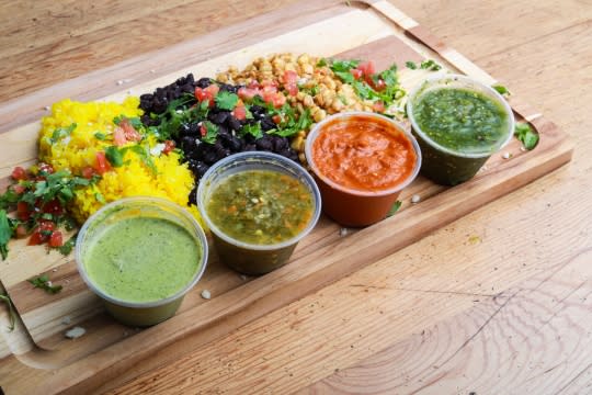 Various vegetable and fruit dips on a board