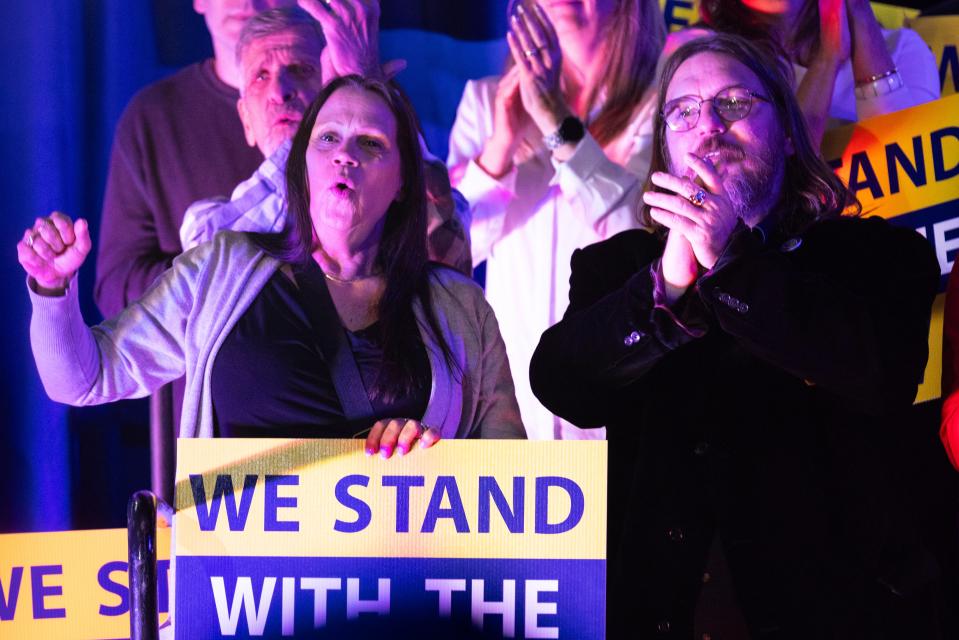 A UAW member holds up a sign and cheers during President Joe Biden's speech Thursday, Nov. 9, 2023, in Belvidere, Illinois, during an event supporting the United Auto Workers of America reaching an agreement with automaker Stellantis.