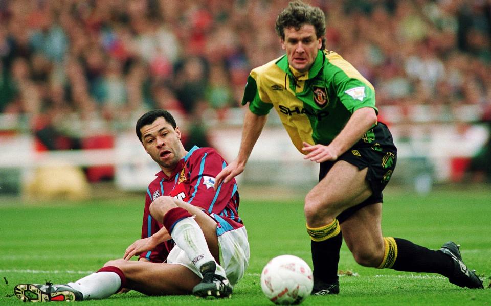 Paul McGrath tackles Mark Hughes - ACTION IMAGES