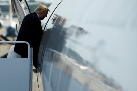 U.S. President Donald Trump boards Air Force One for travel to Naval Station Norfolk from Joint Base Andrews, Maryland, U.S. July 22, 2017. REUTERS/Jonathan Ernst