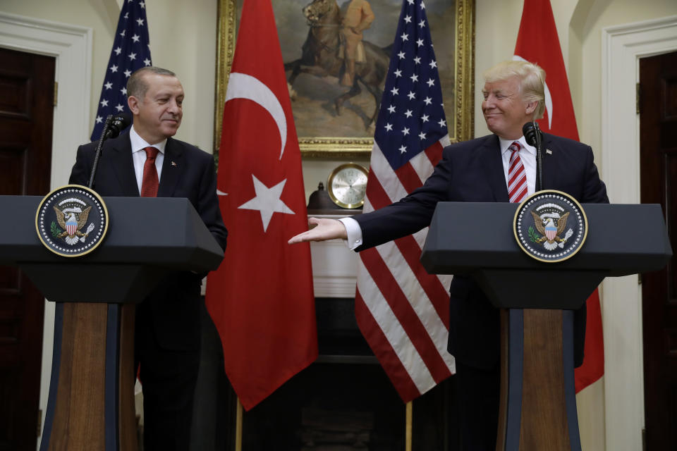 FILE – Then-U.S. President Donald Trump reaches out a hand to Turkish President Recep Tayyip Erdogan at the White House in Washington, Tuesday, May 16, 2017. While in power, Trump derided the leaders of some friendly nations while praising authoritarians such as Erdogan. As chances rise of a Joe Biden-Trump rematch in the U.S. presidential election race, America’s allies are bracing for a bumpy ride. (AP Photo/Evan Vucci, File)