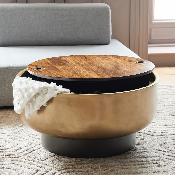 <p><a href="https://go.redirectingat.com?id=74968X1596630&url=https%3A%2F%2Fwww.westelm.com%2Fproducts%2Fdrum-storage-coffee-table-h2557&sref=https%3A%2F%2Fwww.housebeautiful.com%2Froom-decorating%2Fliving-family-rooms%2Fg3164%2Fcoffee-table-storage%2F" rel="nofollow noopener" target="_blank" data-ylk="slk:Shop Now;elm:context_link;itc:0;sec:content-canvas" class="link ">Shop Now</a></p><p>Drum Storage Coffee Table</p><p>westelm.com</p><p>$559.20</p>