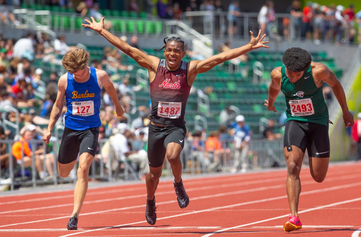 North Salem's DeMari Thompson, center, wins the 6A boys 100 meters ahead of Barlow's Micah Perry, left, and West Salem's Mihaly Akpamgbo, right, during the OSAA state track and field championships at Hayward Field in Eugene Saturday, May 27, 2023.