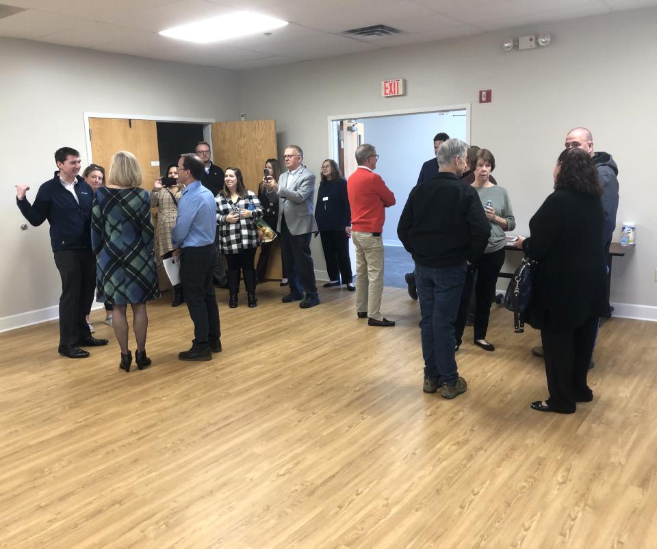 Library, community and Ontario County and Farmington Chamber of Commerce leaders gather in the newly renovated Malone Room at Victor Farmington Library.
