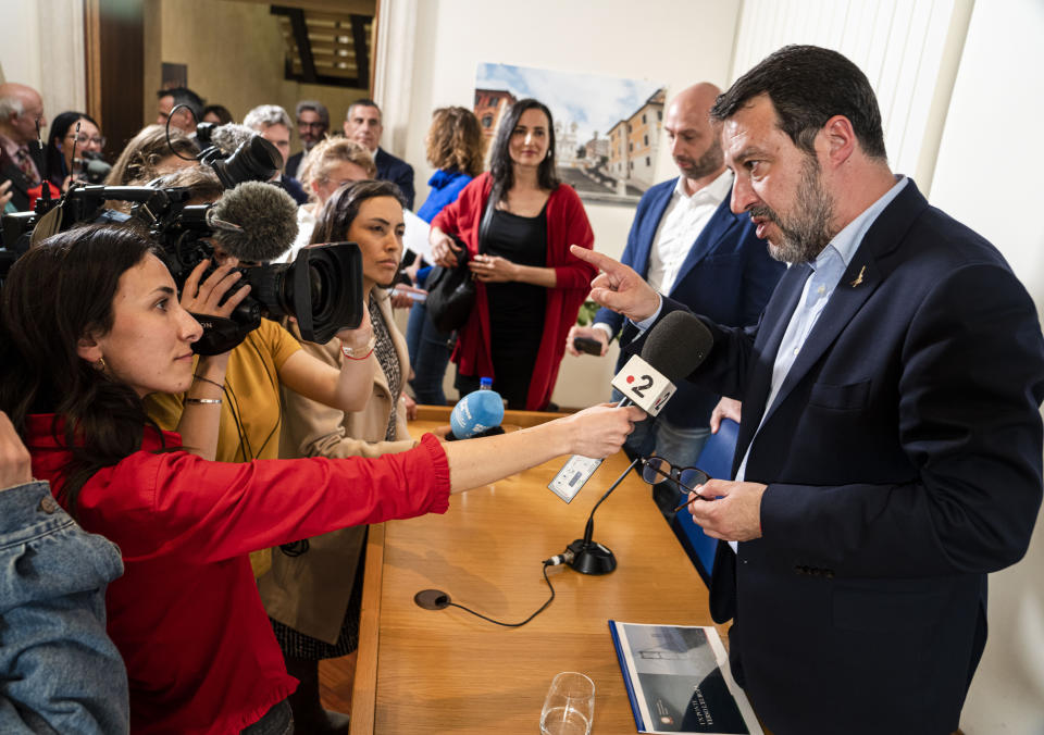 Italian Infrastructures Minister Matteo Salvini, right, answers reporters questions at the end of a press conference at the Foreign Press Club in Rome, Tuesday, April 4, 2023. Salvini addressed questions, among others, about the role of Italy in the migration crisis in the Mediterranean Sea, and about the multi-billion euros project to build a bridge over the Messina strait between Sicily and Calabria in southern Italy. (AP Photo/Domenico Stinellis)