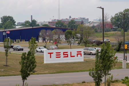 FILE PHOTO - Cars pass by the Tesla Inc. Gigafactory 2, which is also known as RiverBend, a joint venture with Panasonic to produce solar panels and roof tiles in Buffalo, New York