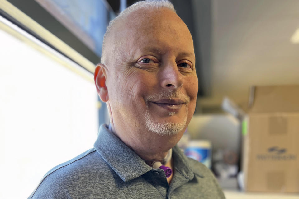 In this photo provided by the Mayo Clinic, Marty Kedian poses for a photo in Mayo Clinic’s Head and Neck Regenerative Medicine Laboratory in Scottsdale, Ariz., on June 12, 2024. Kedian regained his voice after surgeons removed his cancerous larynx and, in a pioneering move, immediately replaced it with a donated one. (Mayo Clinic via AP)