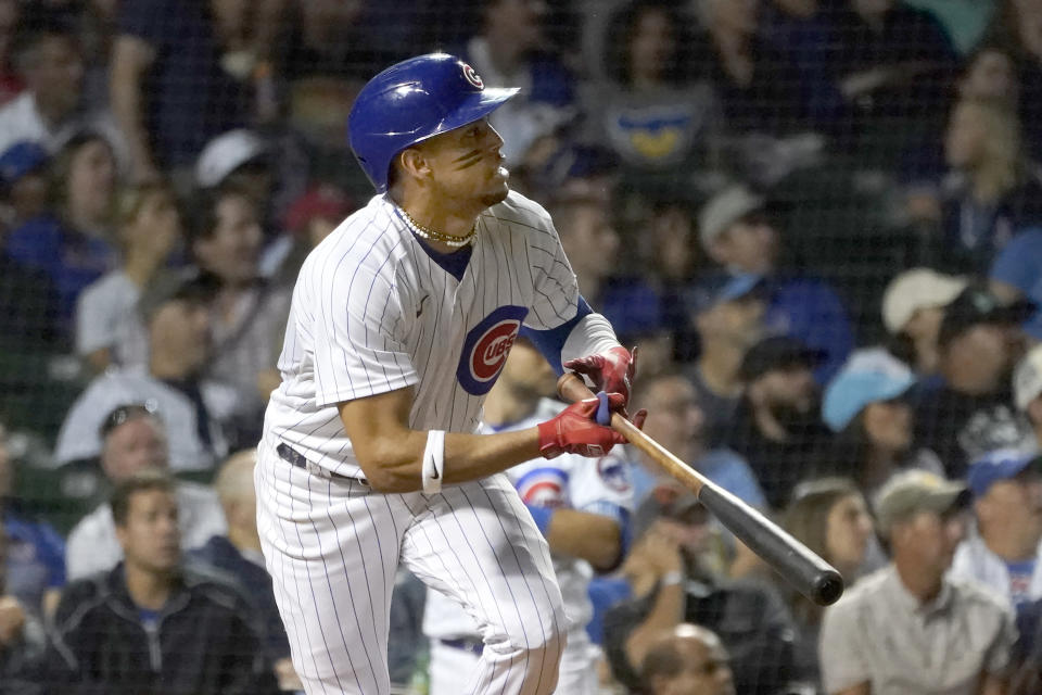 Chicago Cubs' Christopher Morel watches his two-run single off Cincinnati Reds relief pitcher Art Warren during the seventh inning of a baseball game Tuesday, Sept. 6, 2022, in Chicago. (AP Photo/Charles Rex Arbogast)