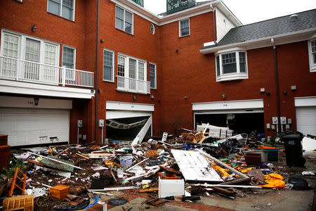 Debris and items from local houses lie scattered in the parking lot after the pass of Hurricane Florence in New Bern, North Carolina, U.S., September 16, 2018. REUTERS/Eduardo Munoz