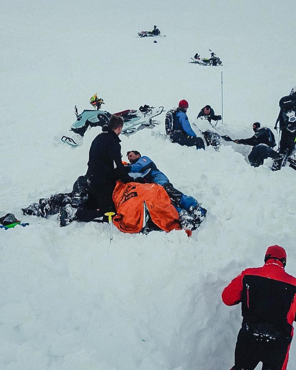 A photo posted by Great Canadian Tours shows rescue operations of a snowmobiler who was trapped in mountain snow near Revelstoke, B.C. on Feb. 26, 2024.