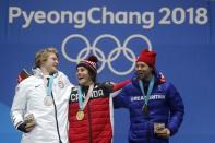 Medals Ceremony - Snowboarding - Pyeongchang 2018 Winter Olympics - Men's Big Air - Medals Plaza - Pyeongchang, South Korea - February 24, 2018 - Gold medalist Sebastien Toutant of Canada, silver medalist Kyle Mack of the U.S., and bronze medalist Billy Morgan of Britain on the podium. REUTERS/Jorge Silva