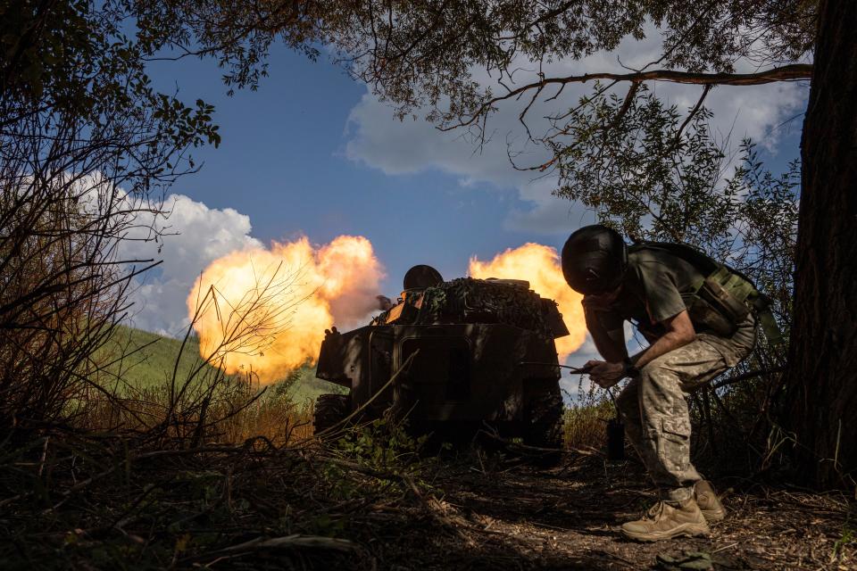 Ukrainian self-propelled artillery shoots towards Russian forces at a frontline Wednesday in Kharkiv region, Ukraine.