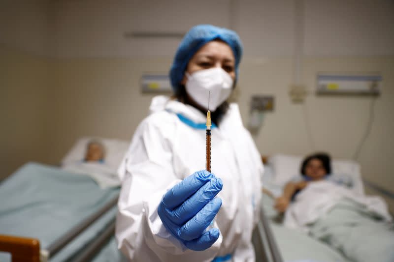 FILE PHOTO: Residents of an elderly home are vaccinated against COVID-19 in Rome