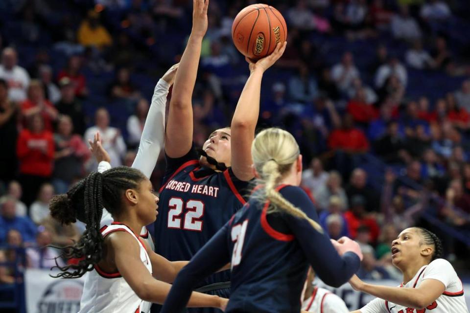 Sacred Heart’s Angelina Pelayo (22) shoots in a crowd during Thursday night’s first-round game against George Rogers Clark in Rupp Arena. Pelayo led the Valkyries with 20 points.