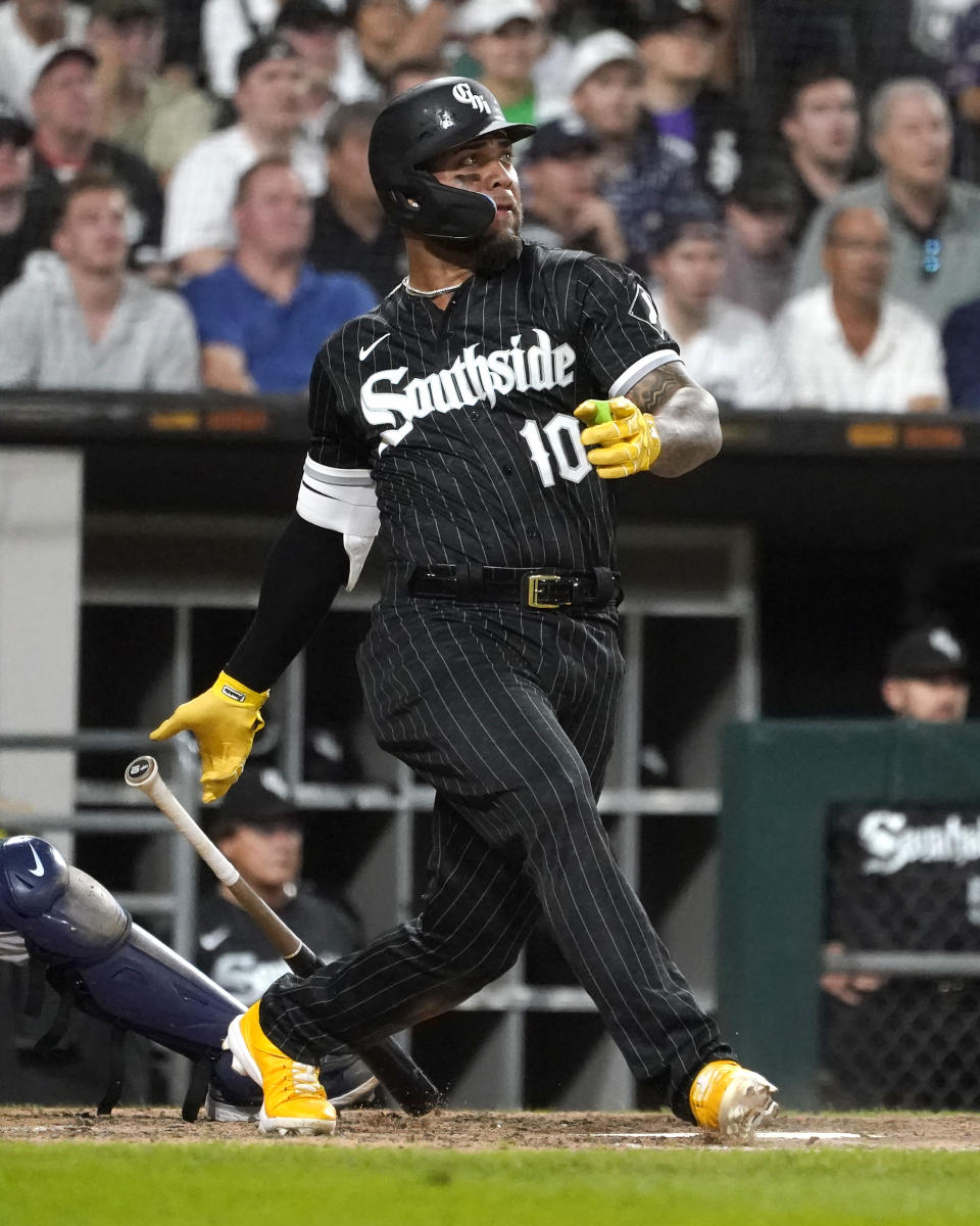 Chicago White Sox's Yoan Moncada watches his RBI single off Houston Astros relief pitcher Hector Neris during the eighth inning of a baseball game Tuesday, Aug. 16, 2022, in Chicago. (AP Photo/Charles Rex Arbogast)