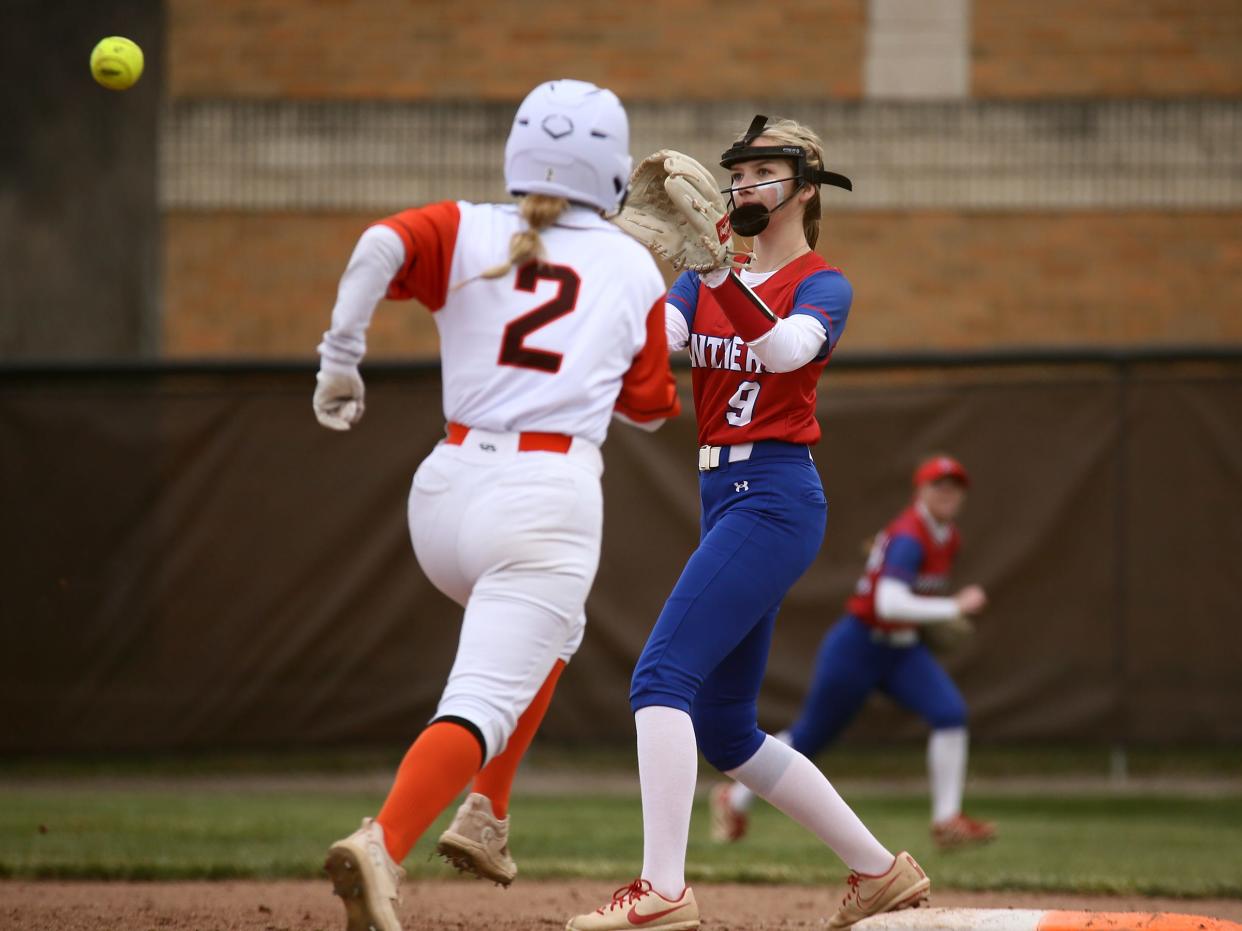 Licking Valley's Tori Baughman catches the throw to first to retire Heath's Emma Ghiloni during the visiting Panthers' 4-0 victory on Thursday, March 28, 2024.