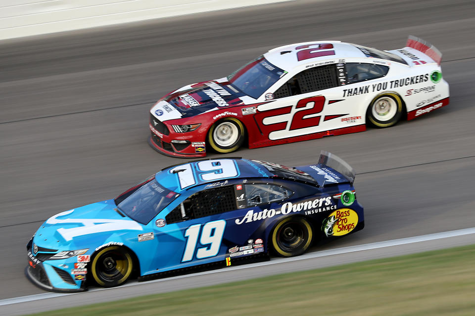 KANSAS CITY, KANSAS - JULY 23: Martin Truex Jr., driver of the #19 Auto Owner's Insurance Toyota, races Brad Keselowski, driver of the #2 Wabash Ford, during the NASCAR Cup Series Super Start Batteries 400 Presented by O'Reilly Auto Parts at Kansas Speedway on July 23, 2020 in Kansas City, Kansas. (Photo by Jamie Squire/Getty Images)