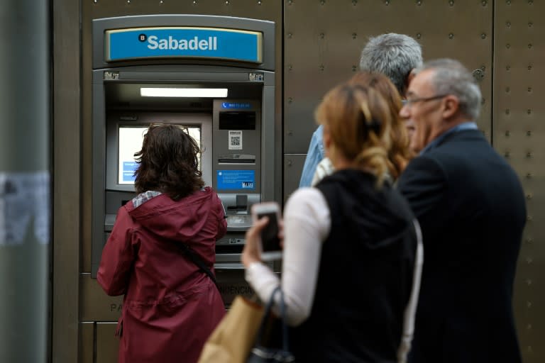 Hundreds of separatists queued at Catalan banks to take out large amounts of cash in protest against Madrid